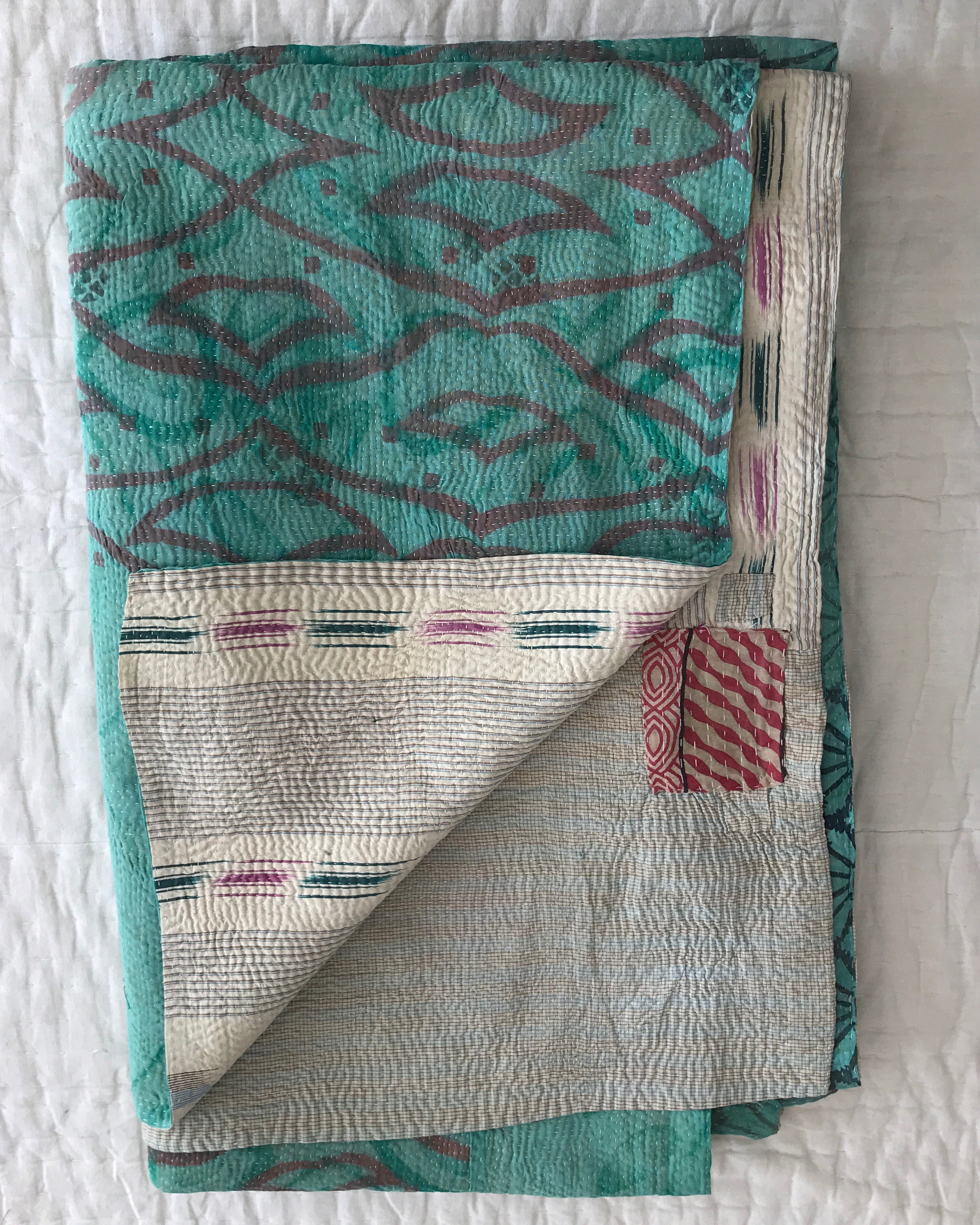 Turquoise Ikat & white check kantha quilt