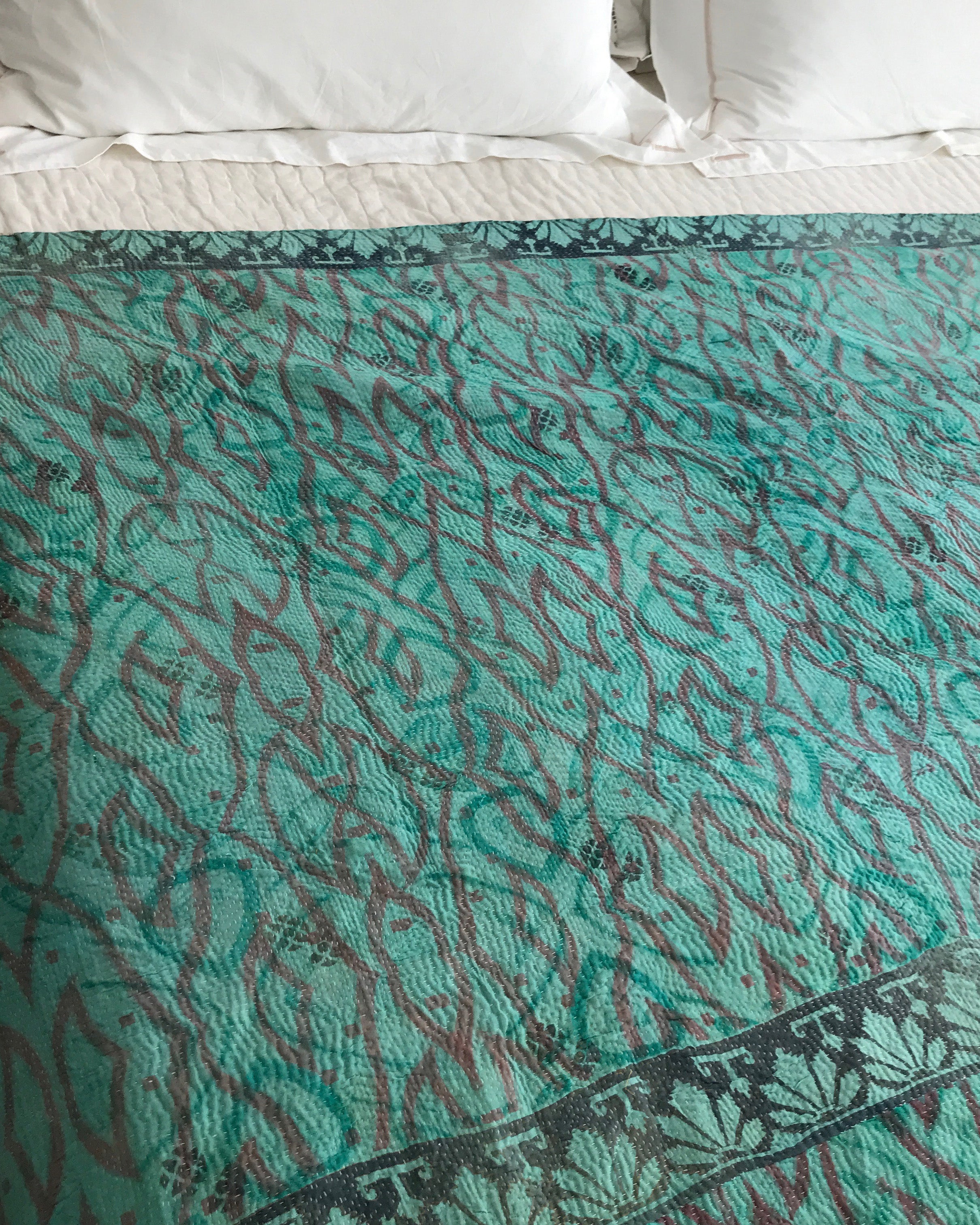 Turquoise Ikat & white check kantha quilt