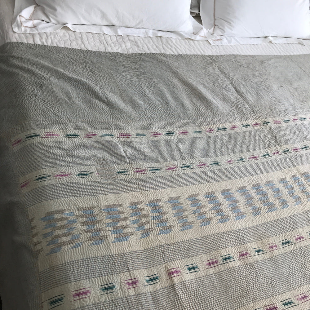 Turquoise Ikat & white check kantha quilt