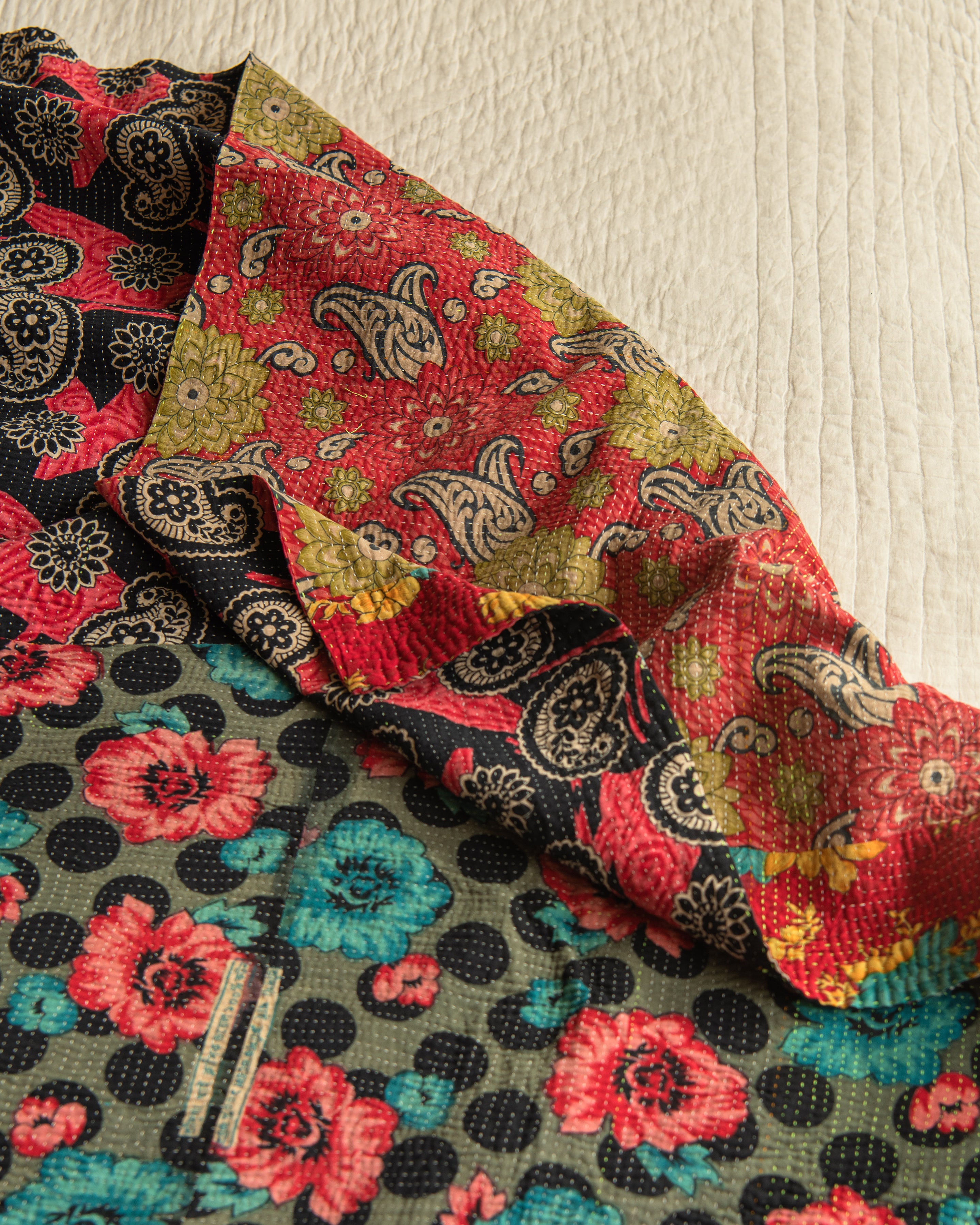 Patchwork of vibrant Floral Kantha quilt