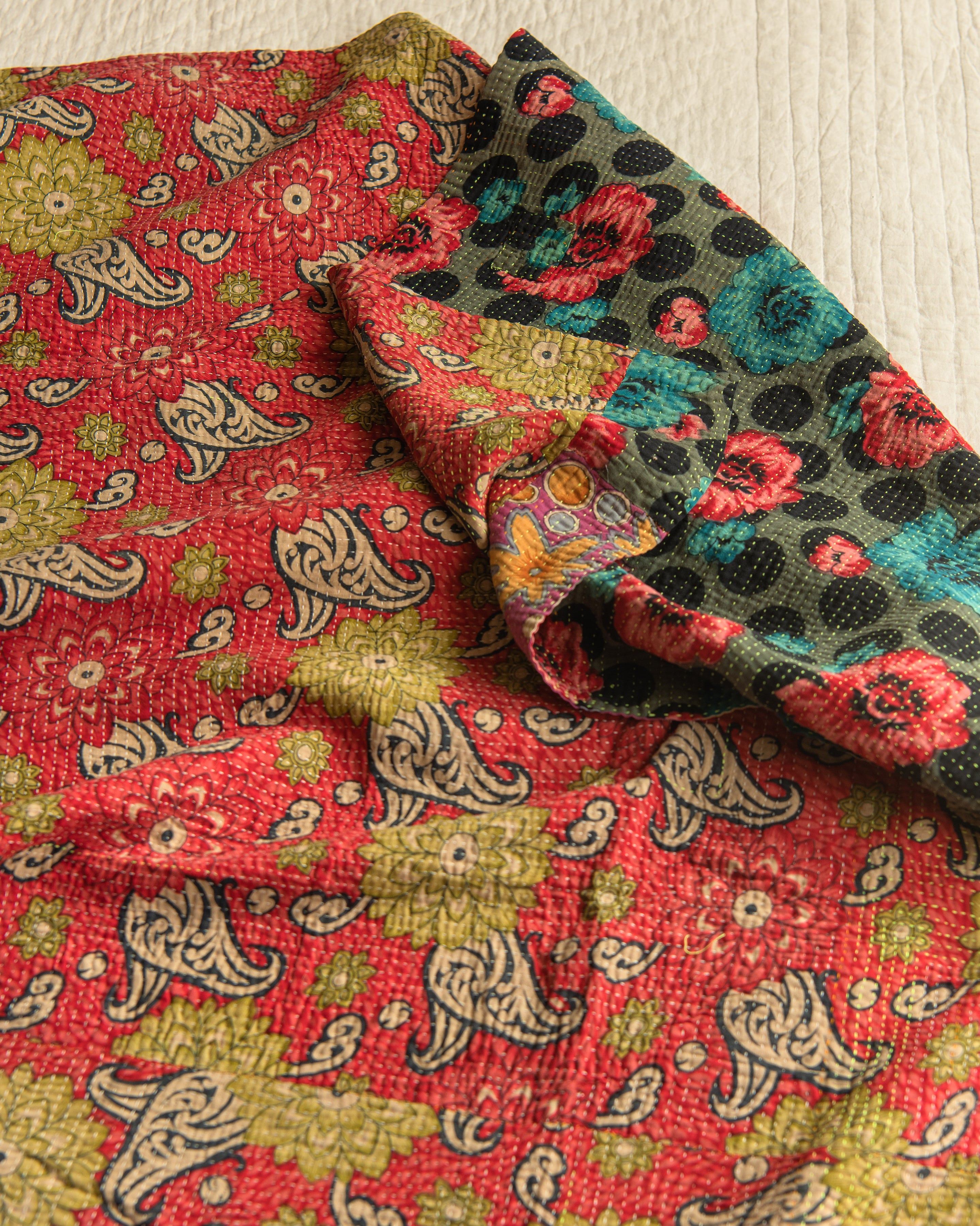 Patchwork of vibrant Floral Kantha quilt