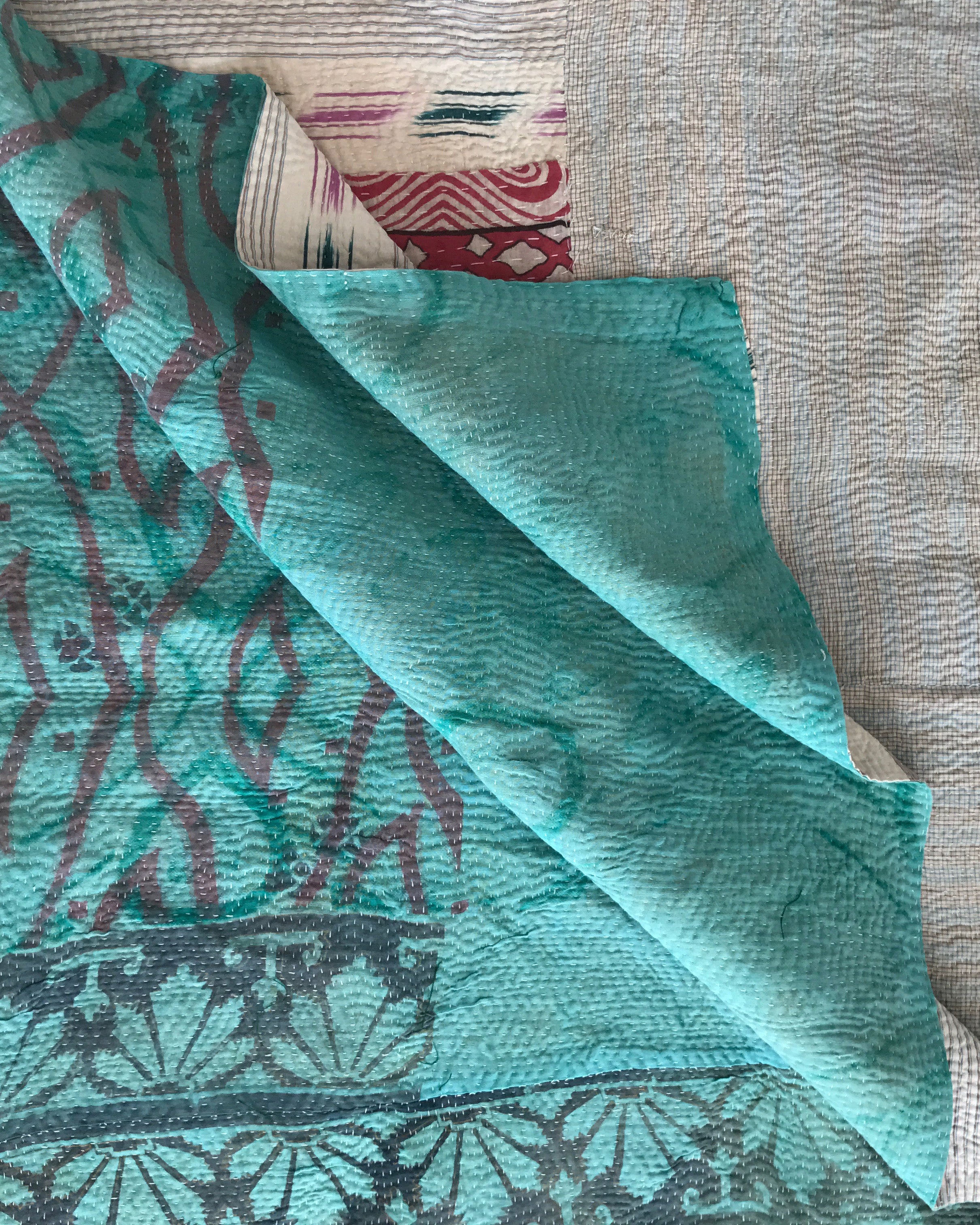 Turquoise Ikat & white check kantha quilt