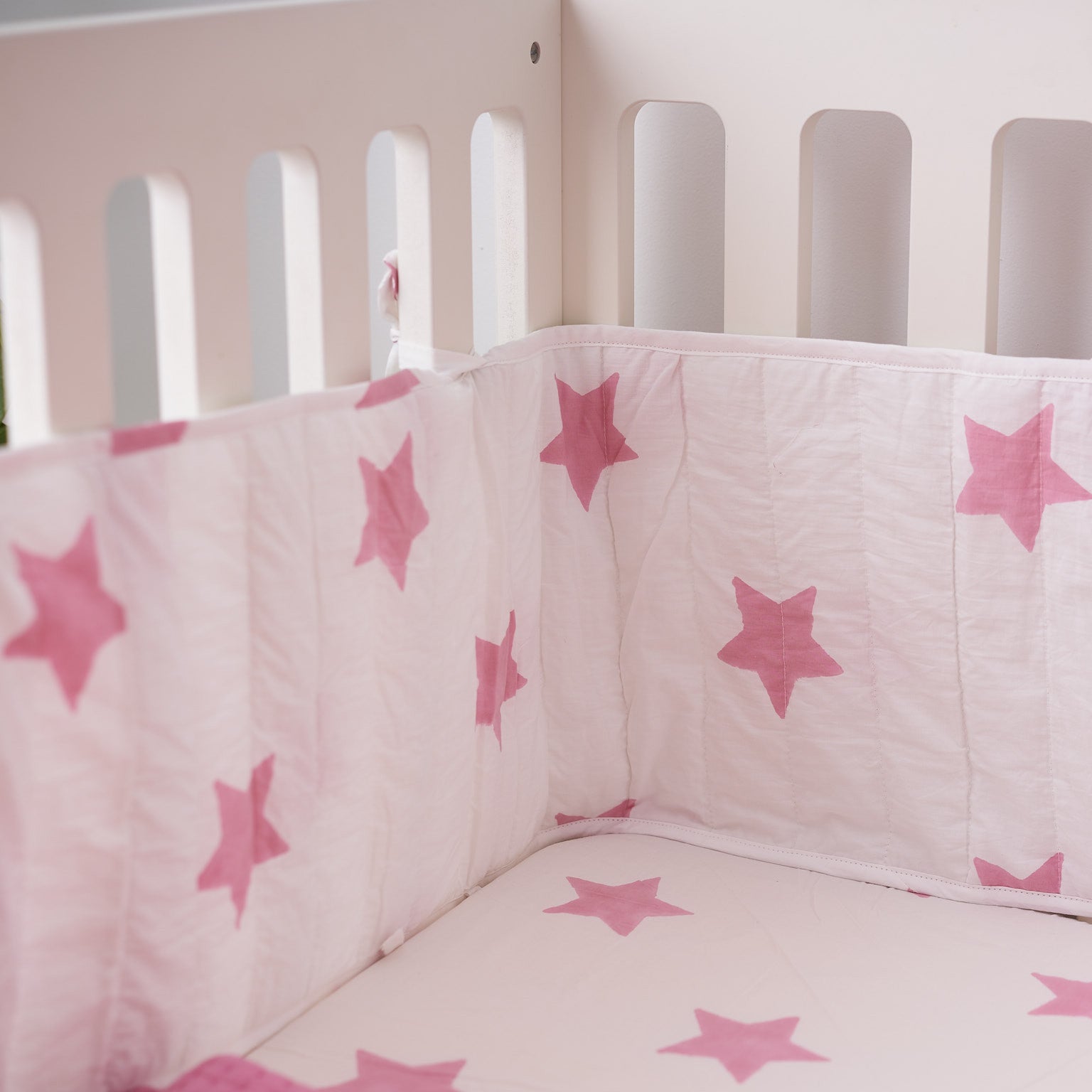 Pastel pink star cot bed bumper